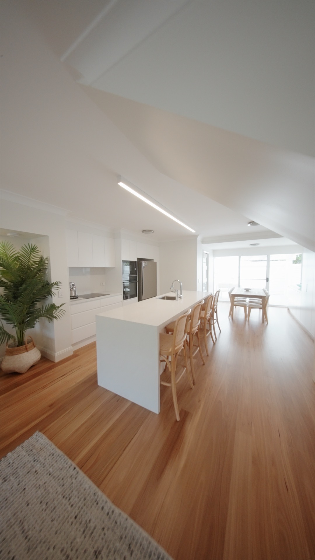 Blackbutt flooring and island kitchen at the Avoca renovation by Halo Building Projects