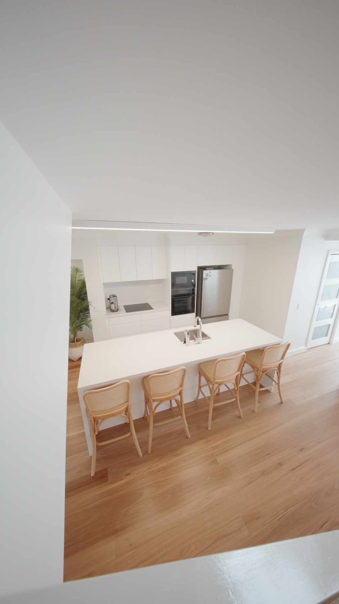 Open plan kitchen at the Avoca renovation by Halo Building Projects
