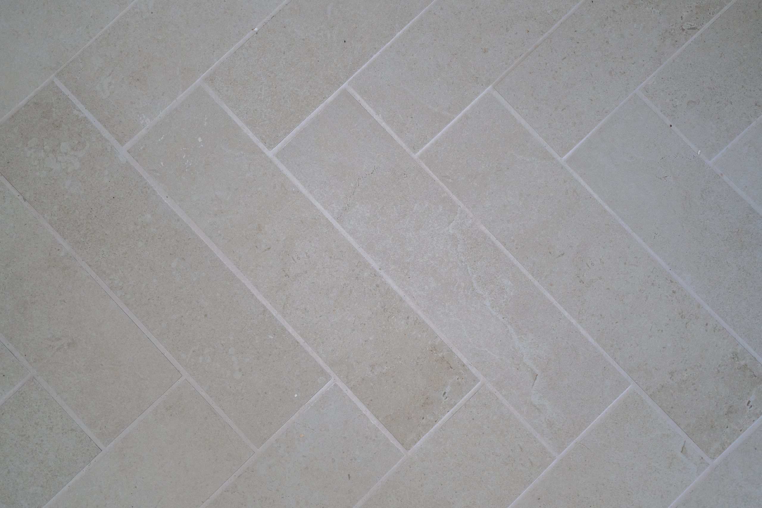 Herringbone wet area tiles at the Davistown renovation by Halo Building Projects